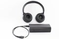 Wireless bluetooth headphones on a white background with a power bank. Royalty Free Stock Photo