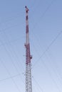 Wireless communications tower against blue sky Royalty Free Stock Photo