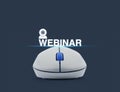 Wireless computer mouse with webinar icon over blue background, Royalty Free Stock Photo