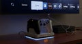Wireless Controller Charging Station with Xbox Series X Console and TV Interface Royalty Free Stock Photo