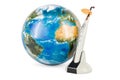 Wireless dental curing light LED with Earth Globe, 3D rendering Royalty Free Stock Photo