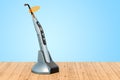 Wireless dental curing light LED on the wooden planks, 3D rendering Royalty Free Stock Photo