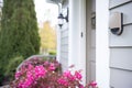 wireless doorbell installed outside of a house