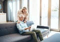 Wireless and enjoying it. mature couple using a laptop on the sofa at home. Royalty Free Stock Photo