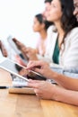 Wireless freedom in the boardroom. a group of businesspeople using their wireless devices during a meeting. Royalty Free Stock Photo