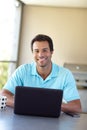 Wireless freedom at home. a handsome man using his laptop at home. Royalty Free Stock Photo