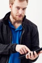 Wireless freedom. Portrait of an unshaven young man working on a digital tablet. Royalty Free Stock Photo