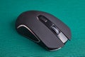 Wireless gaming computer mouse in black, on green Royalty Free Stock Photo