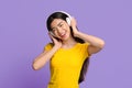 Wireless headphones for music. Portrait of asian girl enjoying listening favorite songs