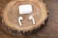 Wireless headphones on the wood Royalty Free Stock Photo