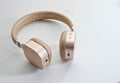 Wireless headset in gold color. Royalty Free Stock Photo