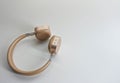 Wireless headset in gold color. Royalty Free Stock Photo