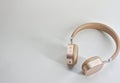 Wireless headset in gold color. Royalty Free Stock Photo