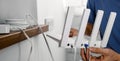 Wireless internet. Service provider technician plug in cables in Wi-Fi router. copy space Royalty Free Stock Photo