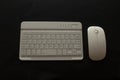 Wireless keyboard and mouse with clipping path. White keyboard with white mouse on black background. White background.  Key Royalty Free Stock Photo