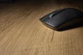 Wireless mouse on a wooden office desk Royalty Free Stock Photo