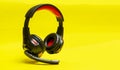 Wireless Over-Ear full size Headphones, Black leather isolated on yellow background . Royalty Free Stock Photo