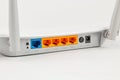 Wireless router back panel with multiple Ethernet ports and power connection Royalty Free Stock Photo