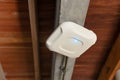Wireless router for internet local network at ceiling. Indoor networking technology. WIFI router or Wireless Access Point setup at