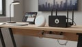 Wireless router and network security device on wooden office desk with cable management system and modern tablet in home workspace Royalty Free Stock Photo