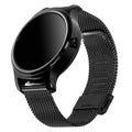 Wireless smart watch in a round glossy black case on a metal strap Royalty Free Stock Photo