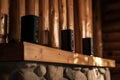 wireless speakers perched on a cabins mantelpiece