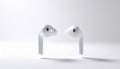 Wireless White Earbuds on Minimalist White Background Modern Technology Accessories Royalty Free Stock Photo
