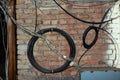 Wires on the brick wall of the attic Royalty Free Stock Photo