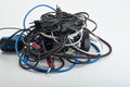 Wires, cables, connecting cords for old computers, dusty, used, tangled in a skein, lie on a white background. Moscow Russia 23.01