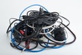 Wires, cables, connecting cords for old computers, dusty, used, tangled in a skein, lie on a white background. Moscow Russia 23.01