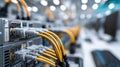 Wires and connectors fill a server mainframe, illuminated by a single light bulb, showcasing advanced data center technology Royalty Free Stock Photo