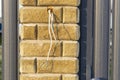 Wires pulled from intercom system in residential area highlighting vandalism incident Royalty Free Stock Photo