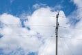 Wires and wire fences under blue sky and white clouds Royalty Free Stock Photo