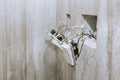 Wiring installation process in room with exposed wall electrical outlets Royalty Free Stock Photo