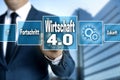 Wirtschaft 4.0 in german economy touchscreen is operated by a Royalty Free Stock Photo