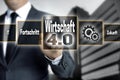 Wirtschaft 4.0 in german economy touchscreen is operated by a Royalty Free Stock Photo