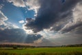 Wisconsin farmland with sunrays coming out of the clouds in September