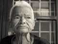 Wise elderly Indian woman in her 80s, showcasing a face with wrinkles and short, white hair. A captivating portrayal of age and Royalty Free Stock Photo