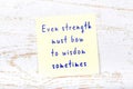 Yellow sticky note with handwritten motivational quote