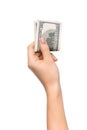 Wise savings. Female hand holding pile of dollars