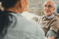 Wise senior directly looking on his doctor while she working with him