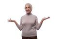 Wise senior woman with gray hair shows disagreement