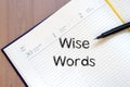 Wise words concept on notebook Royalty Free Stock Photo