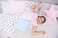 Wish her good morning. Girl child lay on bed her bedroom. Kid awake and full of energy. Pleasant time relax cozy bedroom Royalty Free Stock Photo