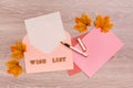 Wish list. Blank paper for writing, envelopes and a fountain pen on a wooden background. Top view Royalty Free Stock Photo