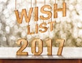 Wish list 2017 wood texture on marble table with sparkling bokeh wall,holiday concept Royalty Free Stock Photo