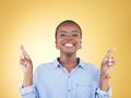 Wish sign, fingers crossed and portrait of black woman in studio smile for hope, winning and success. Emoji, excited and Royalty Free Stock Photo