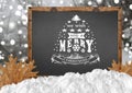 We Wish You A Merry Christmas on blackboard with blurr forest and leaves