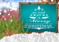 We Wish You A Merry Christmas on blank blue blackboard with blur Royalty Free Stock Photo