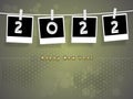 Wishing happy new year 2022 on hanging card with clip beautiful background with blank space for logo and text